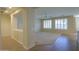 Spacious living room with tile and carpet flooring, and large windows at 3214 N Desert Horizons Ln, Casa Grande, AZ 85122