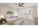 Spacious bedroom with bay window and ceiling fan at 3835 E Grove Ave, Mesa, AZ 85206