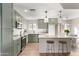 Renovated kitchen featuring green cabinets and granite countertops at 3835 E Grove Ave, Mesa, AZ 85206