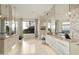 Luxurious bathroom with double vanities, freestanding tub, and large window at 5630 E Rockridge Rd, Phoenix, AZ 85018