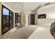 Bright bedroom with sliding glass doors opening to a private patio at 5630 E Rockridge Rd, Phoenix, AZ 85018