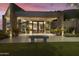 Modern home entrance with glass doors and stone facade at 5630 E Rockridge Rd, Phoenix, AZ 85018
