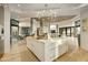 Open concept kitchen with large island and views into living room at 5630 E Rockridge Rd, Phoenix, AZ 85018