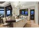Sleek kitchen with breakfast bar, island, and stunning city views at 5630 E Rockridge Rd, Phoenix, AZ 85018