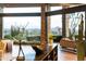 Sophisticated living area with floor-to-ceiling windows and city views at 5630 E Rockridge Rd, Phoenix, AZ 85018
