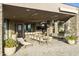 Covered patio features a built-in grill, dining area, and relaxing lounge chairs at 5630 E Rockridge Rd, Phoenix, AZ 85018
