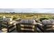 Outdoor patio with fire pit and seating area overlooking city at 5630 E Rockridge Rd, Phoenix, AZ 85018