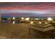 Night view of a luxurious pool and patio area at 5630 E Rockridge Rd, Phoenix, AZ 85018