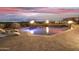 Luxury pool with fire features and city views at night at 5630 E Rockridge Rd, Phoenix, AZ 85018