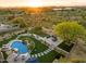 Luxury backyard oasis featuring a pool, spa, and fire pit at 6450 E Bent Tree Dr, Scottsdale, AZ 85266