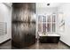 Elegant bathroom with a unique wall design and freestanding tub at 6450 E Bent Tree Dr, Scottsdale, AZ 85266