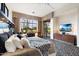 Main bedroom with large windows and patio access at 6450 E Bent Tree Dr, Scottsdale, AZ 85266