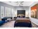 Spacious bedroom with a tufted headboard and large artwork at 6450 E Bent Tree Dr, Scottsdale, AZ 85266
