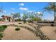 Gated community entrance with landscaping and signage at 6450 E Bent Tree Dr, Scottsdale, AZ 85266