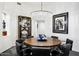 Elegant dining room with a round table and crystal chandelier at 6450 E Bent Tree Dr, Scottsdale, AZ 85266