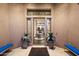 Grand entryway with glass doors and modern design at 6450 E Bent Tree Dr, Scottsdale, AZ 85266