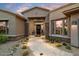 Beautiful exterior with a stone walkway and landscaping at 6450 E Bent Tree Dr, Scottsdale, AZ 85266