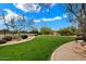 Landscaped green space with trees and seating areas at 6450 E Bent Tree Dr, Scottsdale, AZ 85266