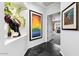 Bright hallway with artwork and access to bedroom at 6450 E Bent Tree Dr, Scottsdale, AZ 85266