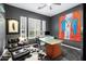 Modern home office with a glass-top desk and comfortable chair at 6450 E Bent Tree Dr, Scottsdale, AZ 85266