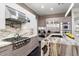 Gourmet kitchen featuring stainless steel appliances and marble countertops at 6450 E Bent Tree Dr, Scottsdale, AZ 85266