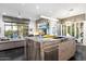 Gourmet kitchen with large island, stainless steel appliances, and open layout at 6450 E Bent Tree Dr, Scottsdale, AZ 85266