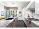 Modern kitchen with marble countertops and breakfast bar at 6450 E Bent Tree Dr, Scottsdale, AZ 85266