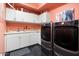 Convenient laundry room with washer, dryer, and ample storage at 6450 E Bent Tree Dr, Scottsdale, AZ 85266