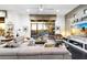 Spacious living room with comfortable seating and large sliding glass doors at 6450 E Bent Tree Dr, Scottsdale, AZ 85266