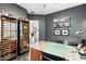 Home office with built-in wine storage and ample workspace at 6450 E Bent Tree Dr, Scottsdale, AZ 85266