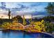 Stunning pool and waterfall feature at sunset at 6450 E Bent Tree Dr, Scottsdale, AZ 85266