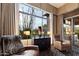 Relaxing sitting area with comfy armchairs and large windows offering scenic views at 6450 E Bent Tree Dr, Scottsdale, AZ 85266