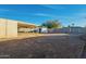 Large backyard with covered patio and storage shed at 1025 S Lola Ln, Tempe, AZ 85281