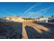 Backyard view showing house exterior, patio, and shed at 1025 S Lola Ln, Tempe, AZ 85281