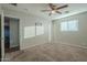 Bright bedroom with ceiling fan and carpeted floor at 1025 S Lola Ln, Tempe, AZ 85281