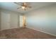 Well-lit bedroom with ceiling fan and carpet at 1025 S Lola Ln, Tempe, AZ 85281