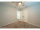 Spacious bedroom with ceiling fan and carpeted floor at 1025 S Lola Ln, Tempe, AZ 85281