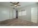 Bedroom with ceiling fan, carpet, and double closet at 1025 S Lola Ln, Tempe, AZ 85281
