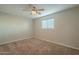 Cozy bedroom with ceiling fan and carpeted floor at 1025 S Lola Ln, Tempe, AZ 85281