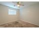 Bright bedroom with ceiling fan and carpeted floor at 1025 S Lola Ln, Tempe, AZ 85281