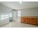 Simple kitchen with wood cabinets and tiled floor at 1025 S Lola Ln, Tempe, AZ 85281