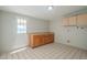 Laundry room with cabinets and exterior access door at 1025 S Lola Ln, Tempe, AZ 85281