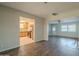 Open living room with hardwood floors and views to kitchen at 1025 S Lola Ln, Tempe, AZ 85281