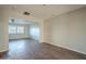 Open living area with hardwood floors and views to kitchen at 1025 S Lola Ln, Tempe, AZ 85281
