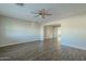 Open living room with hardwood floors and access to other rooms at 1025 S Lola Ln, Tempe, AZ 85281