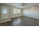 Spacious living area with hardwood floors and large windows at 1025 S Lola Ln, Tempe, AZ 85281