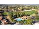 Aerial view of community pool, landscaping, and surrounding homes at 11806 N 40Th Pl, Phoenix, AZ 85028