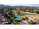 Aerial view of community with tennis courts and golf course at 11806 N 40Th Pl, Phoenix, AZ 85028