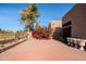 Landscaped backyard with brick patio and red flowers at 11806 N 40Th Pl, Phoenix, AZ 85028