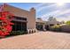 Landscaped backyard with brick patio and terracotta pots at 11806 N 40Th Pl, Phoenix, AZ 85028